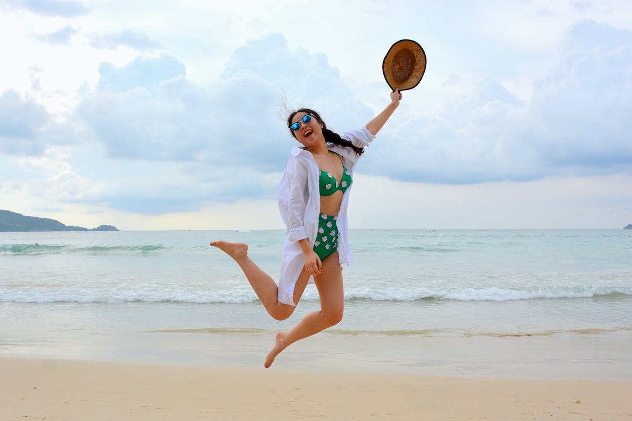 Tourist jumping on the Beach P